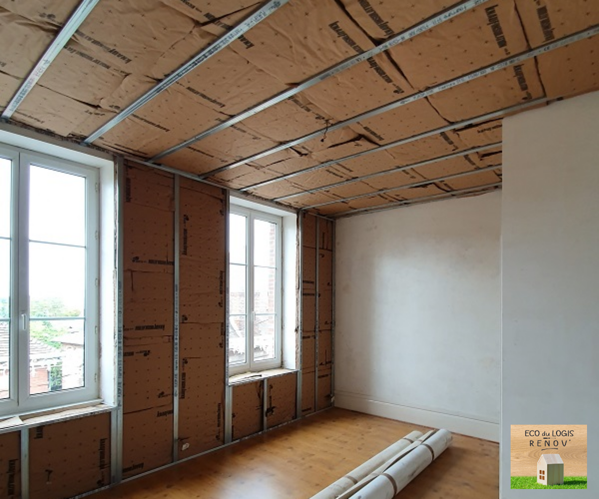 Isolation de murs et plafonds dans un logement locatif sur L'Aigle